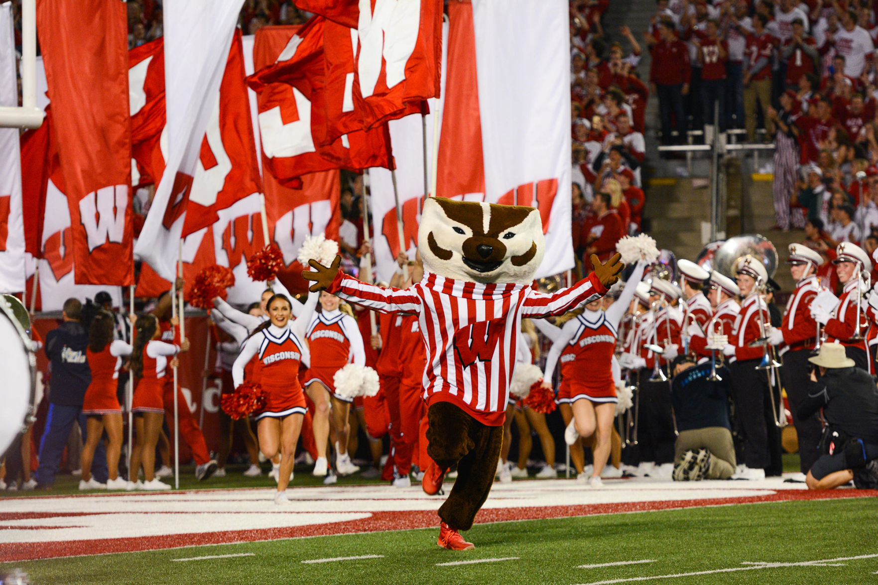 Bucky Badger runs onto the field at Camp Randall for a UW-Madison football game.